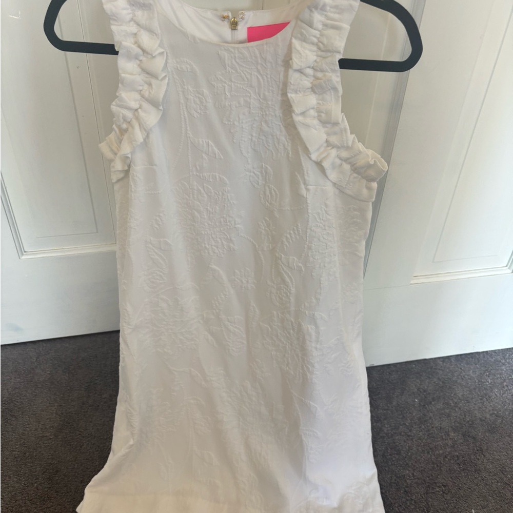 Elegant White Sleeveless Dress with Ruffle Details